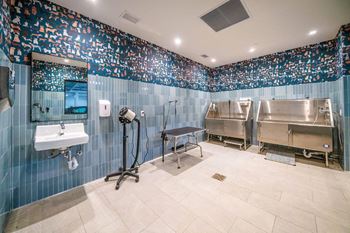 a large bathroom with two stainless steel appliances and a sink