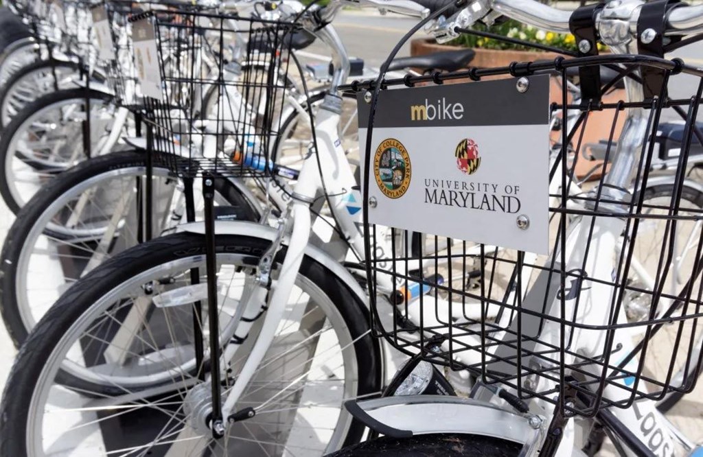 a bike rack with a sign