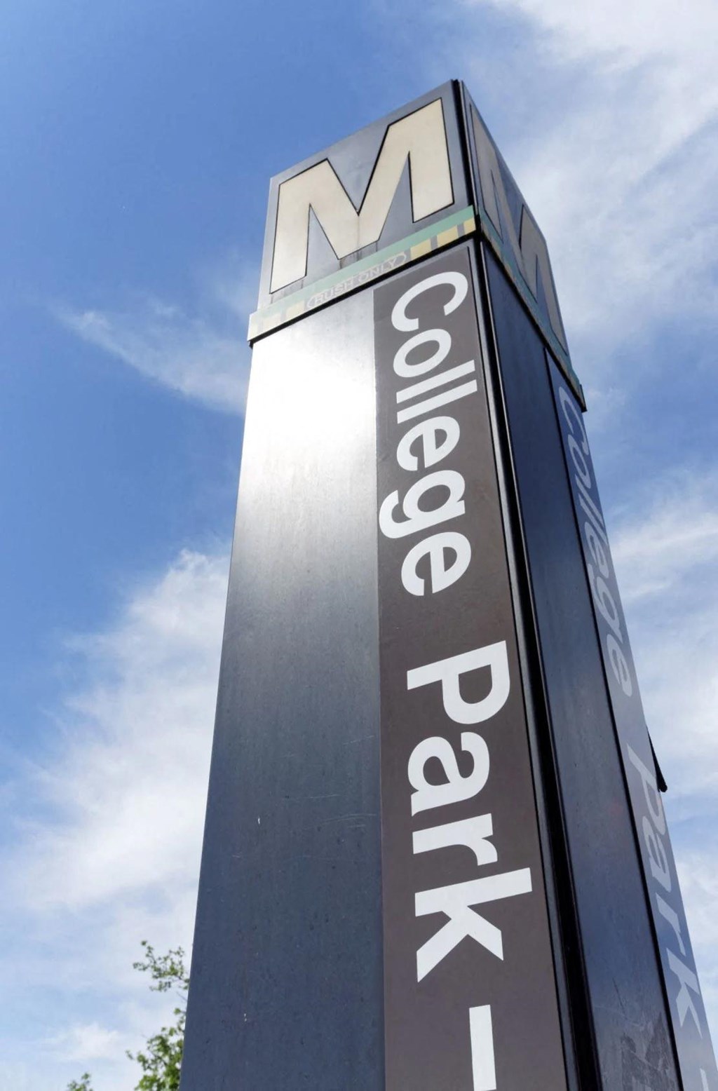 a tall sign for a shopping center