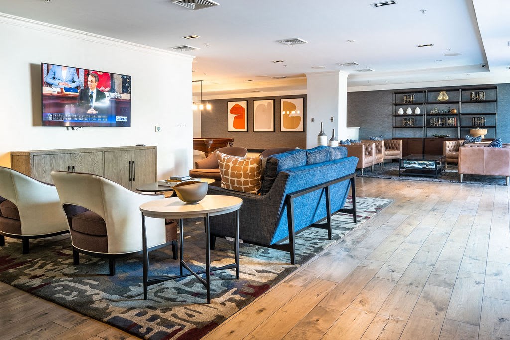 a living room filled with furniture and a tv