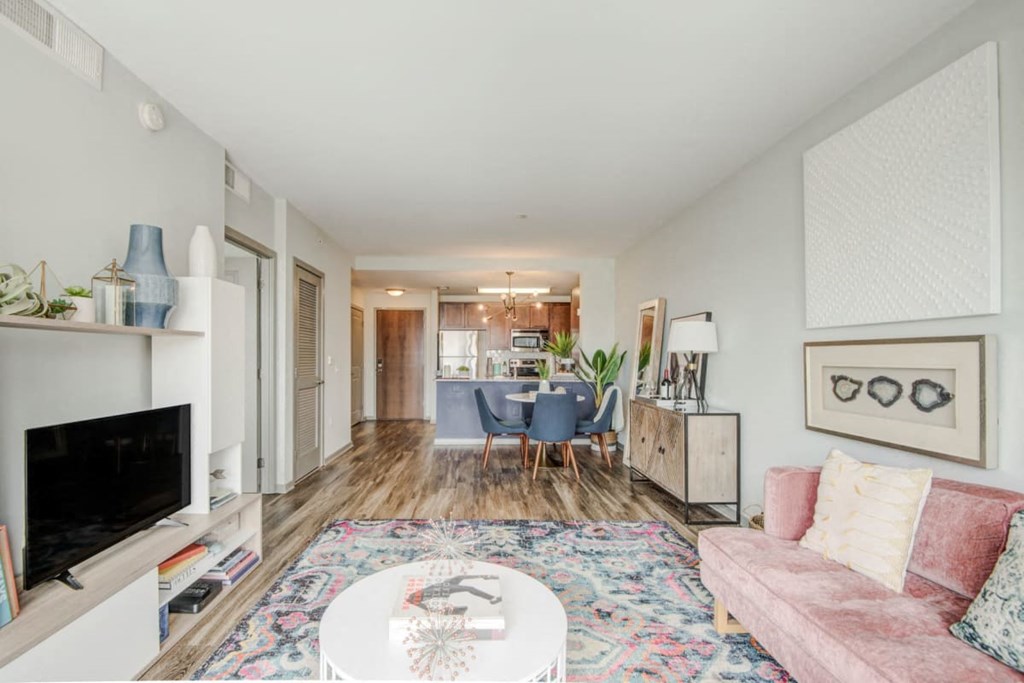 a living room with a couch and a table and a tv