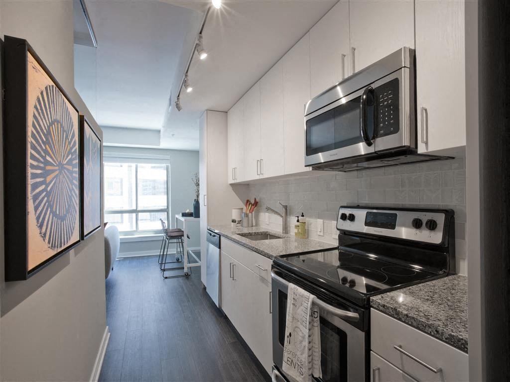 a kitchen with a stove and a microwave