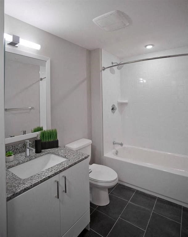 a bathroom with a sink toilet and a shower