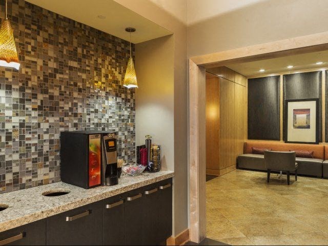 a kitchen with a coffee maker on the counter