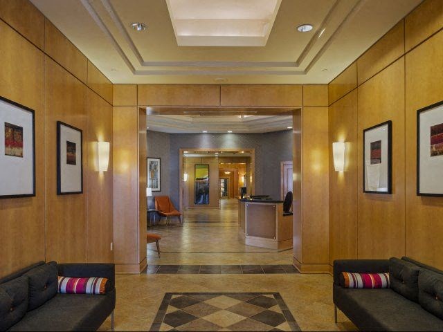 the lobby of a building with couches