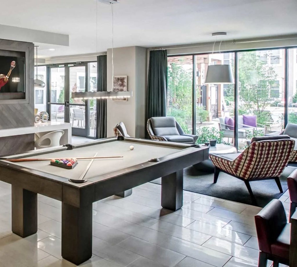 a pool table in the living room of a house