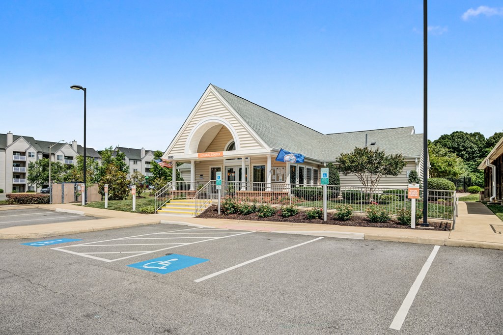 the front of a church building with a parking lot