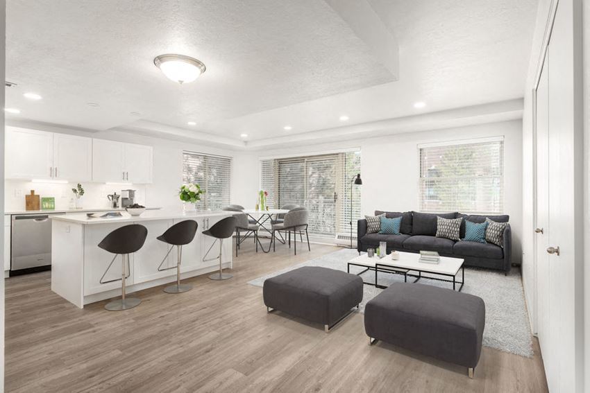 Great room next to kitchen with kitchen island and dining area space
