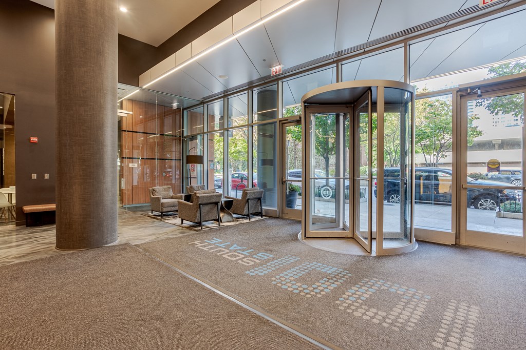 A hallway with a carpet that has the word "STAFF" on it.
