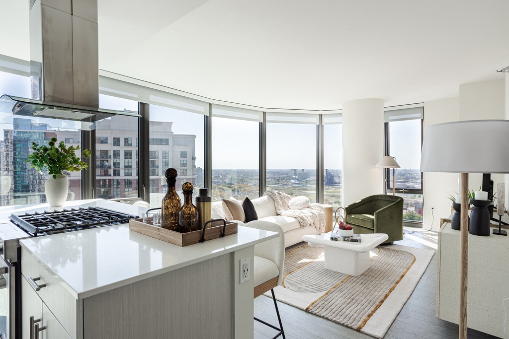 A modern kitchen with a view of the city.