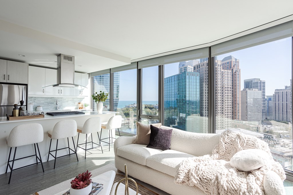 A modern living room with a view of the city skyline.