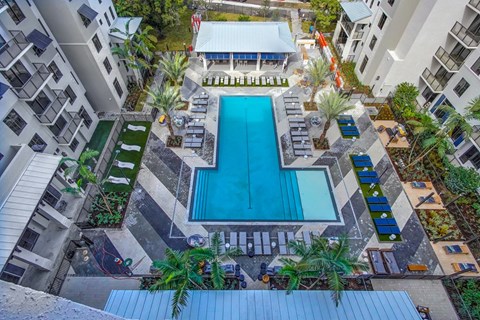 a view of the pool from above of an apartment building with a swimming pool