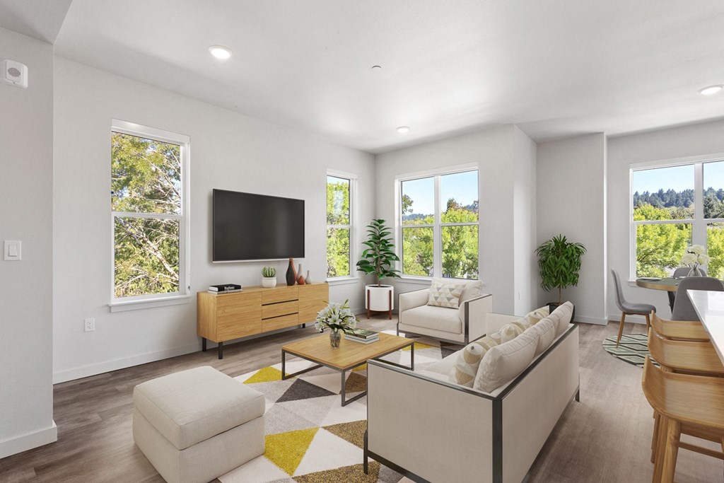 a living room with white walls and a yellow and white rug (Hawthorne Building)