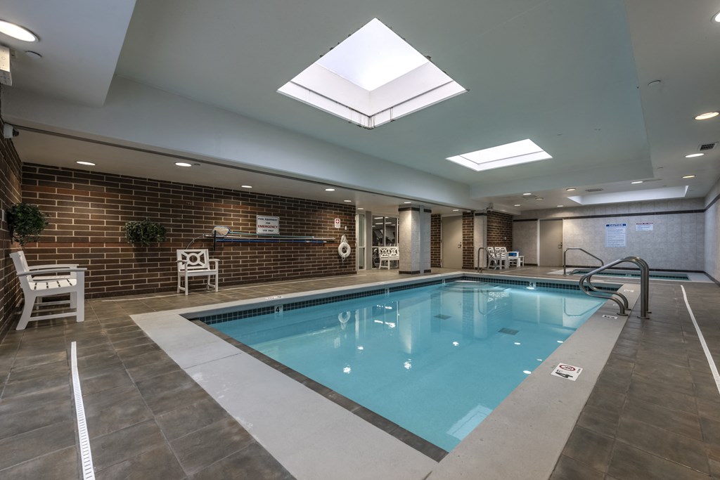 Indoor swimming pool with seating area
