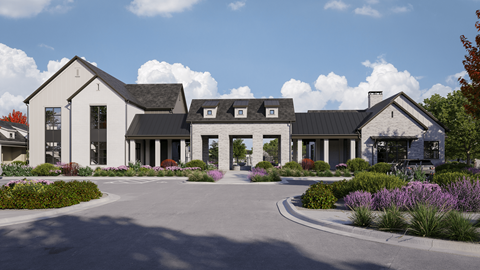 A white house with a black roof and a driveway in front.