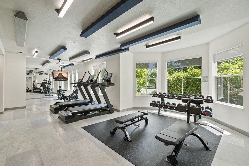 a room filled with furniture and a large window