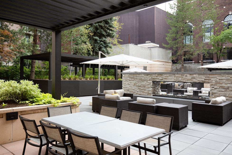 Courtyard with seating area and a fireplace