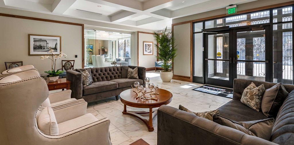 Lobby area with a view of the entrance doors and seating area