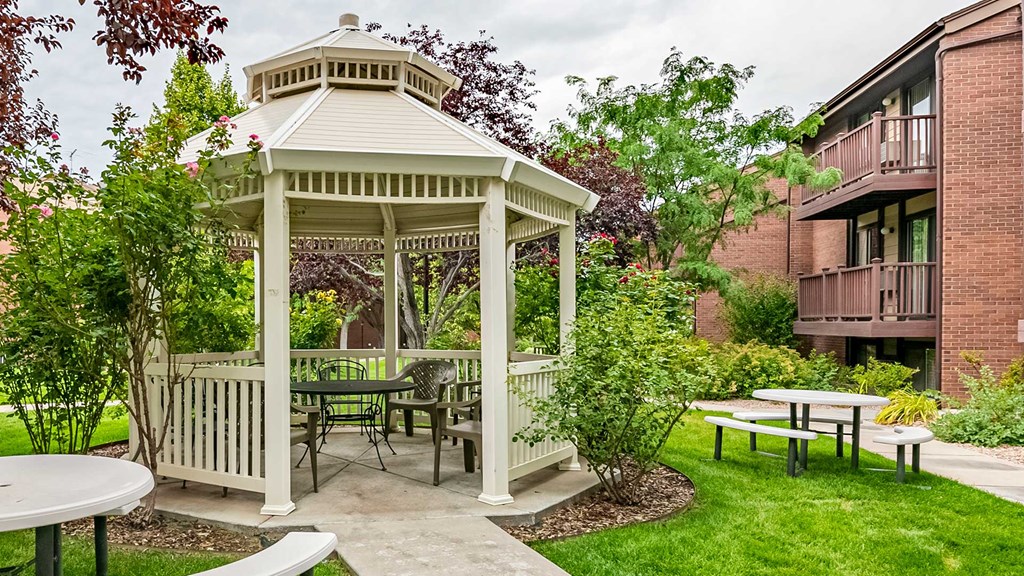 White gazebo with seating areas