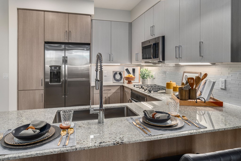 kitchen with granite counter tops and stainless steel appliances