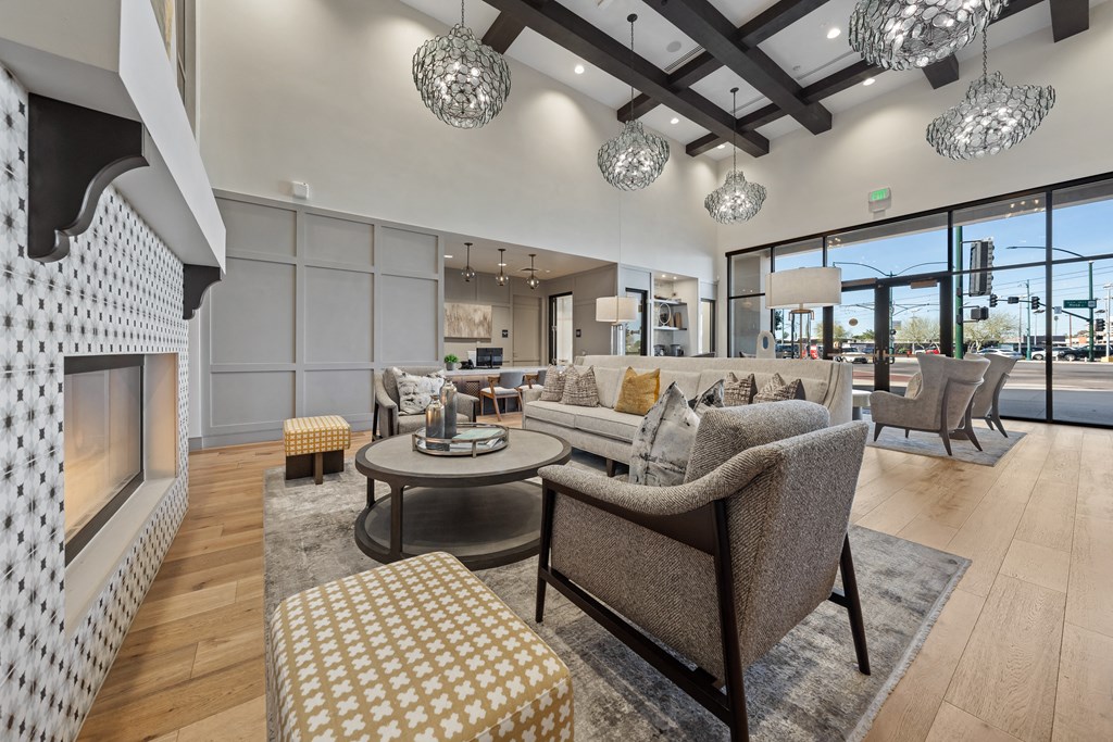 a living room with couches and chairs and a fireplace