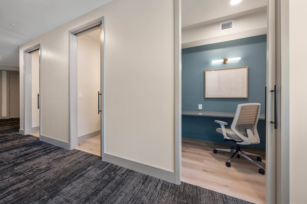 A room with a blue wall and a white chair.
