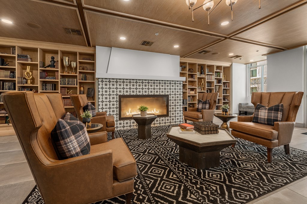 a living room filled with furniture and a fireplace