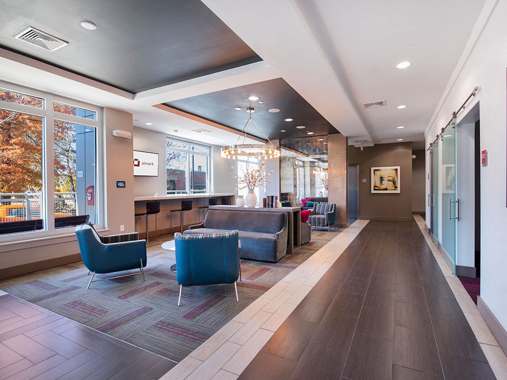 Seating area at Atmark with chairs, couches, and coffee tables