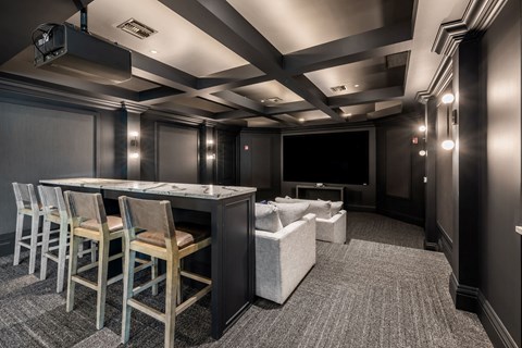 A conference room with a long table and chairs.