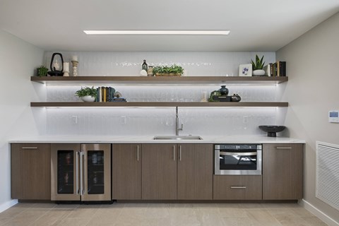 a kitchen with wooden cabinets and a white counter top