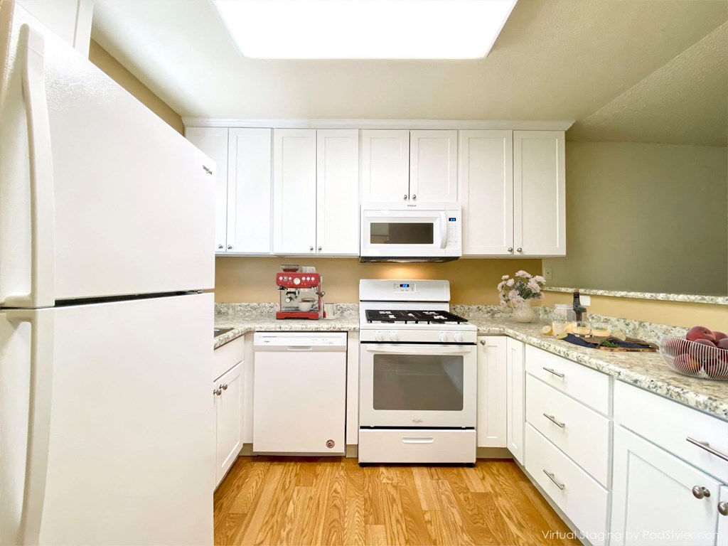 Kitchen With White Cabinetry And Appliances at Carrington Apartments, Fremont, California