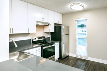 Quartz Countertops in Kitchen with Hardwood Flooring at 1038 on Second in Lafayette, 94549