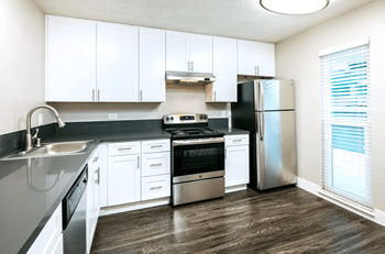 Kitchen with White Cabinets and Stainless Steel Appliances at 1038 on Second in Lafayette, California