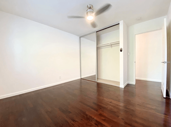 Large Open Space Bedroom Layout with Dark Hardwood Flooring and a Large Closet at Jefferson Street in Santa Clara, 95050