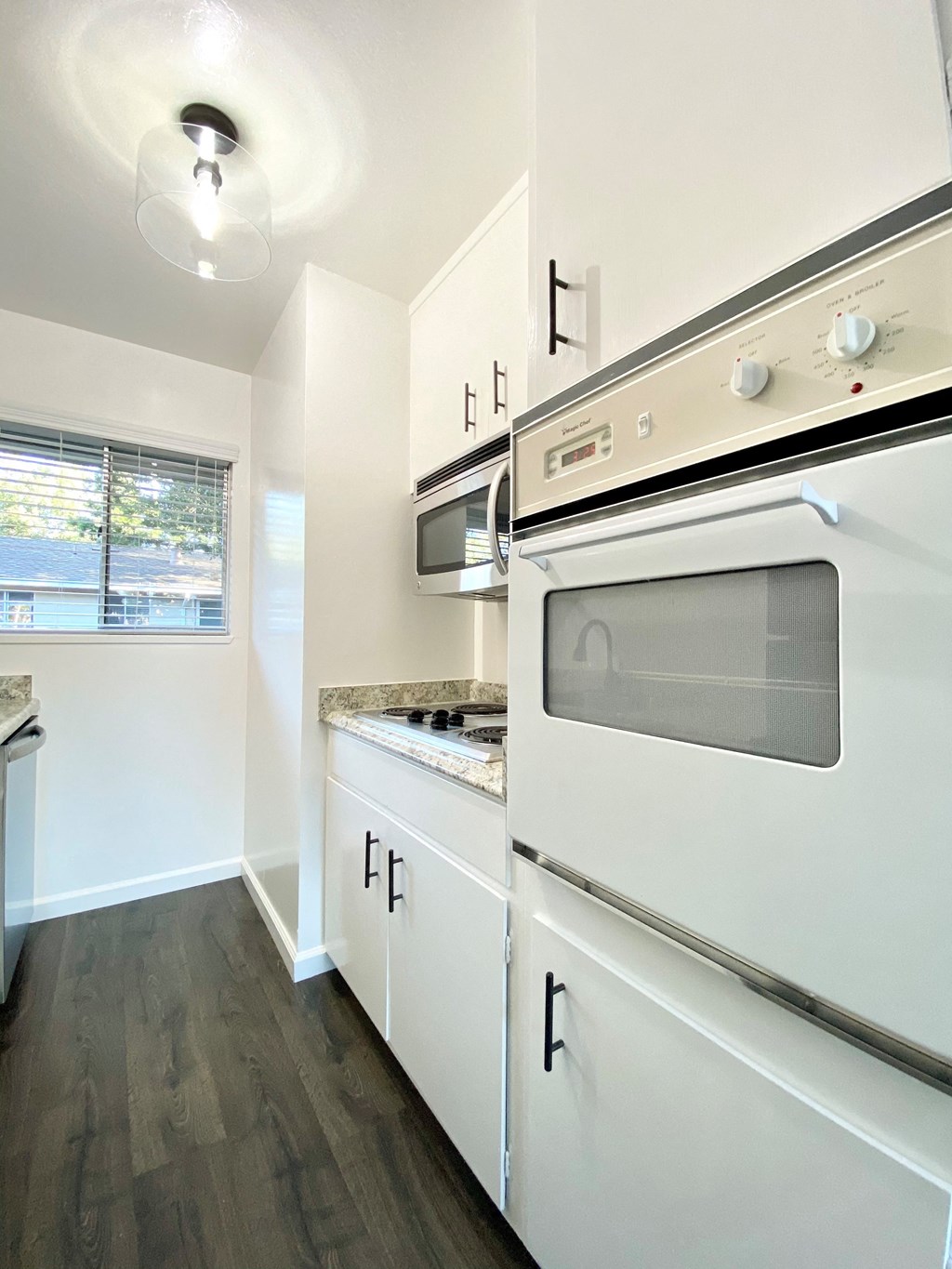 Kitchen with Oven and Hardwood Floors at 2120 Valerga in Belmont, California 94002