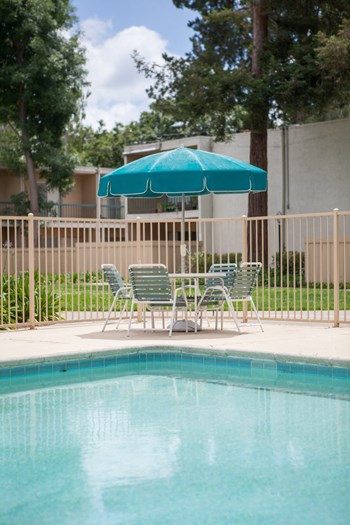 Swimming Pool Area With Shaded Chairs Swimming Pool Area With Shaded Chairs at Diablo Pointe, California, 94596 - Photo Gallery 4