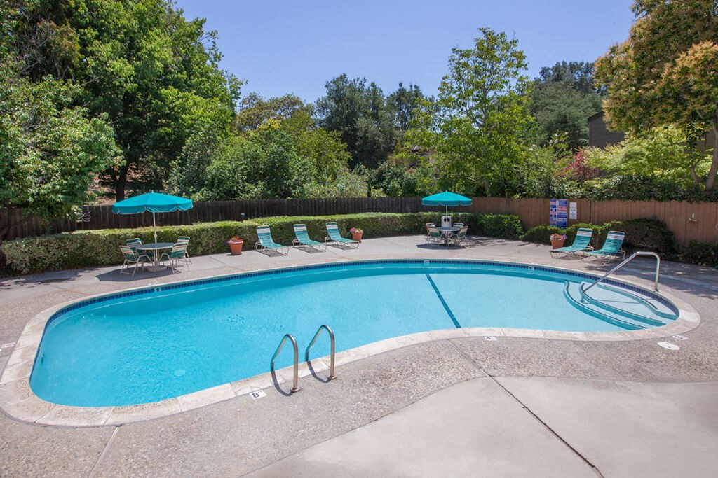 Swimming Pool Area With Shaded Chairs at The Glens, San Jose, 95125