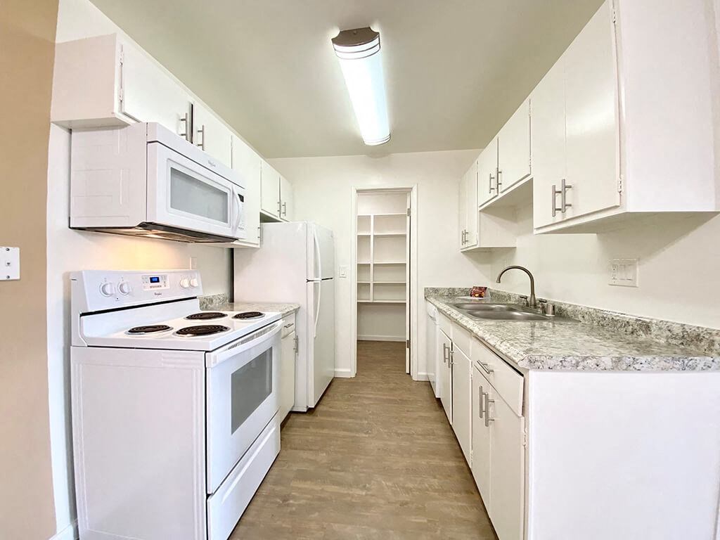 Kitchen With White Cabinetry And Appliances at The Monterey, San Jose, CA