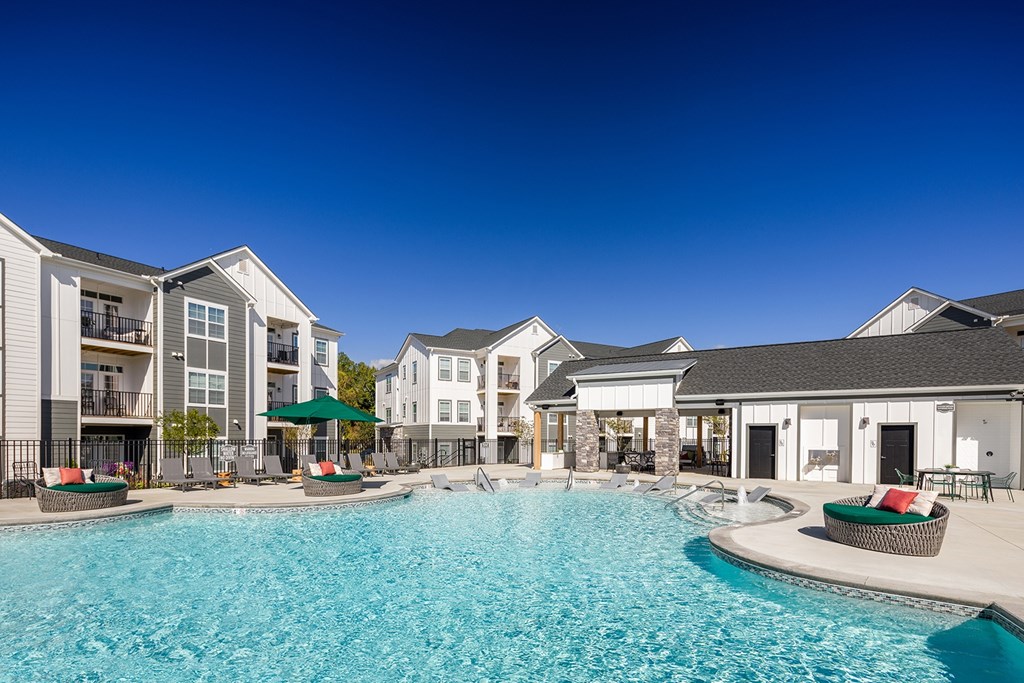 A swimming pool in front of apartment buildings at 198 Milltown Apartments, North Carolina, 27215
