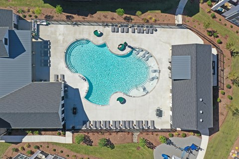 An aerial view of a house with a blue pool in the backyard.at 198 Milltown Apartments, Burlington  