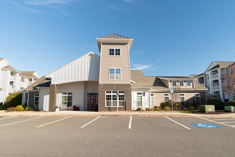 A large building with a parking lot in front of it. at Concord Ridge Apartments, Concord, NC, 28027