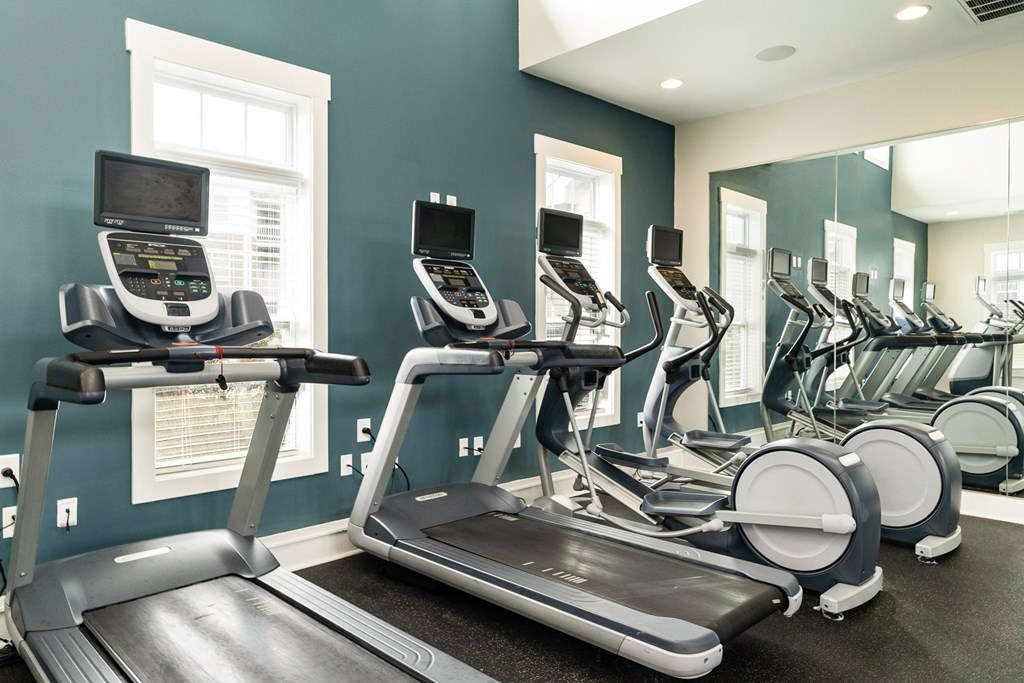 A row of treadmills in a gym. at Concord Ridge Apartments, Concord, NC, 28027
