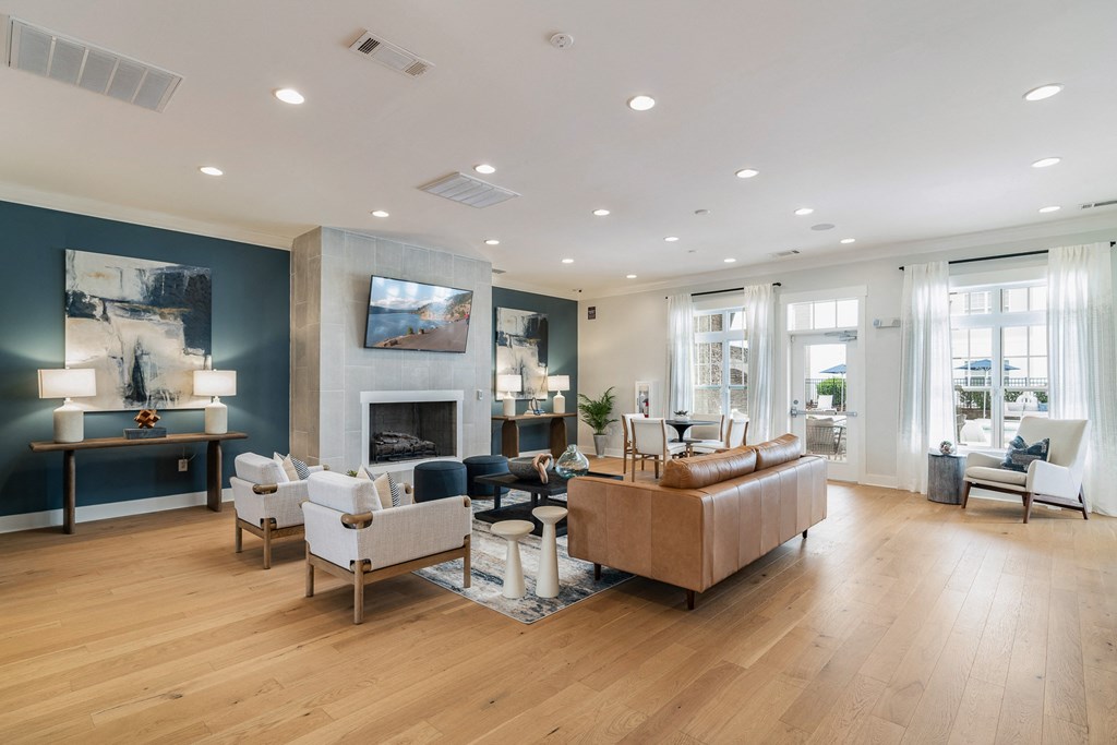 A living room with a fireplace and a couch. at Concord Ridge Apartments, Concord, NC