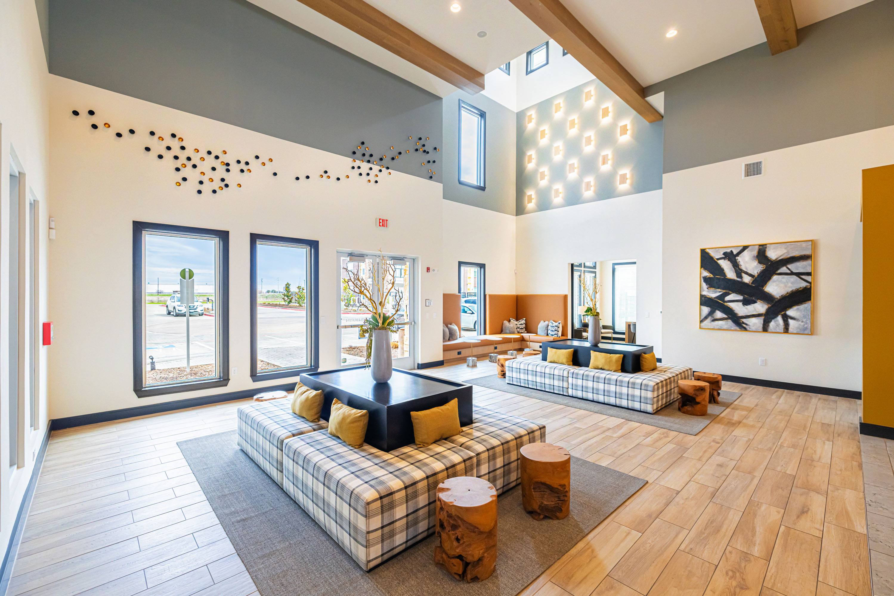 a large living room with couches and a table