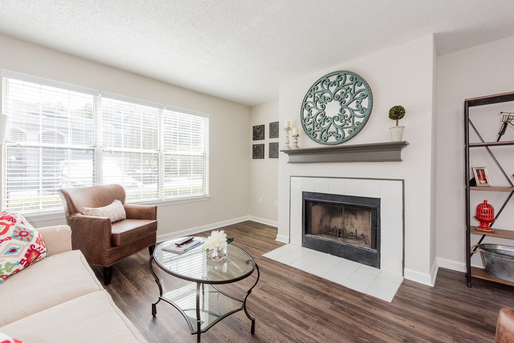 A living room with a fireplace and a couch. at WildForest Apartments, Birmingham, 35209
