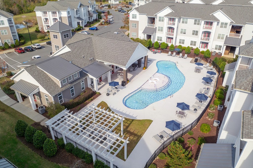 An aerial view of at Concord Ridge Apartments, Concord, NC with a pool in the foreground.