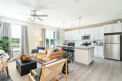 A modern kitchen with a dining table and chairs.