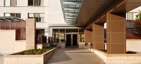the front entrance of a building with a wheelchair ramp