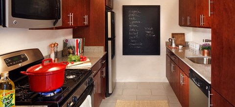 a kitchen with a pot on the stove