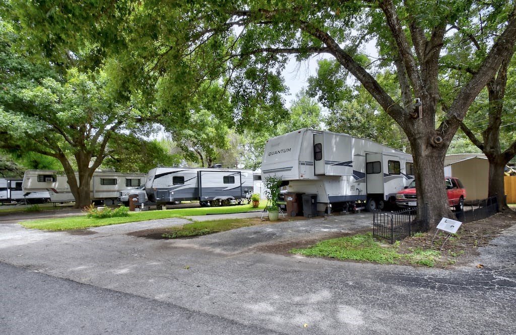 a group of recreational vehicles parked in a parking lot